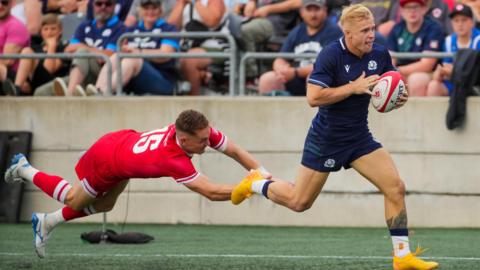 Arron Reed scores a try for Scotland against Canada