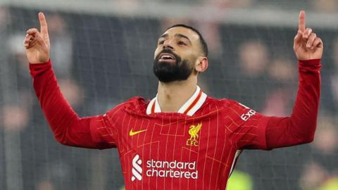 Mohamed Salah celebrates scoring for Liverpool against Lille in the Champions League