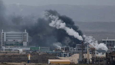 Smoke rises following an Iranian missile strike at an industrial site in southern Israel on Sunday