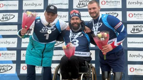 Left to right: Kazakhstan's Yerbol Khamitov (silver medallist), USA's Aaron Pike (gold) and Britain's Scott Meenagh (bronze)