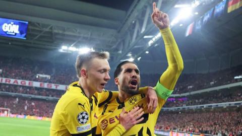 Borussia dortmund captain Emre Can (R) celebrates with German forward Maximilian Beier