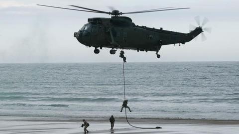 Royal Marines Commandos abseil from an RAF Sea King helicopter onto the beaches or Roker and Seaburn during the Sunderland International Air Show in 2015