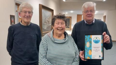 Hartlepool Fairtrade Steering Group members Keith Gorton, Chris Eddowes and Martin Green with their Fairtrade Town certificate