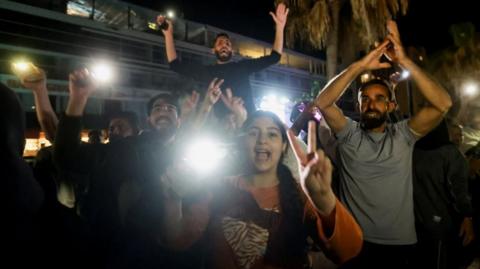 People celebrate in Lebanon as the ceasefire begins