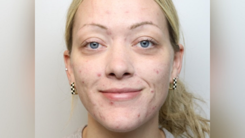 Mugshot of Ellie Watson, who has tied back her blonde hair and is smiling.