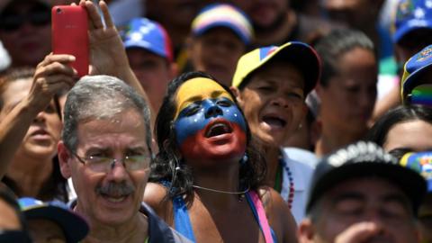 Supporters of Venezuelan opposition leader and self-declared president Juan Guaido attend a rally in Guatire, Miranda state, Venezuela on 18 May
