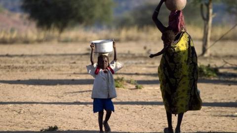 Refugees collecting water