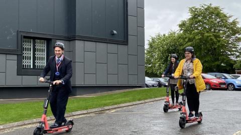 Petroc CEO and students try out the scooters