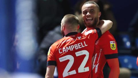 Carlton Morris (right) celebrates his second goal against QPR