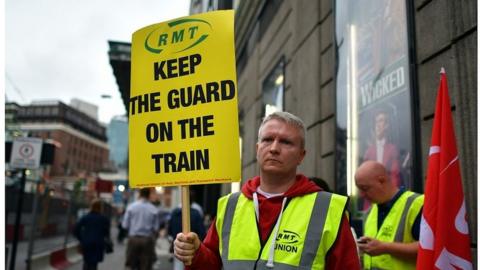 Southern Rail employee on picket line in 2016 during dispute over removing guards from trains