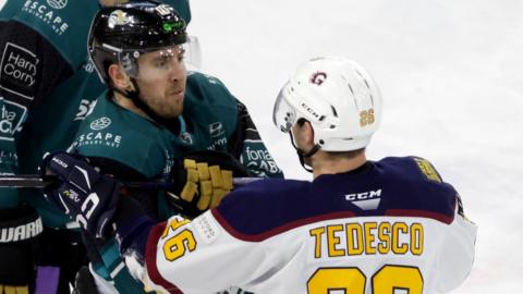 Belfast's Scott Conway tangles with Guildford's Daniel Tedesco at the SSE Arena