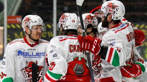 Cardiff Devils players celebrate Blake Thompson's goal