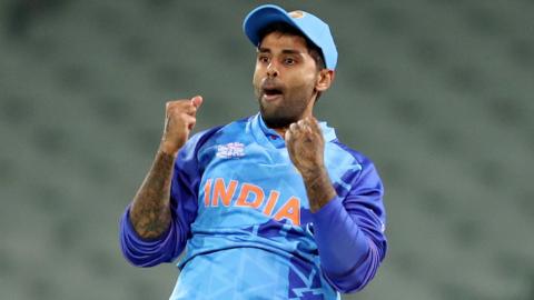 India's Suryakumar Yadav celebrates taking a catch