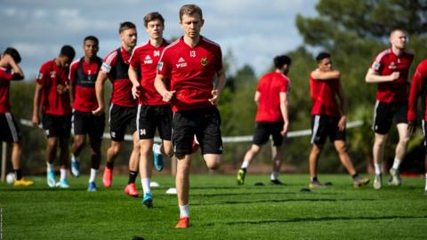 The Ostersund players complete another running session.