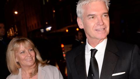 Philip Schofield and wife Stephanie Lowe arriving for the wedding reception of Frank Lampard and Christine Bleakley at the Arts Club in Mayfair, London