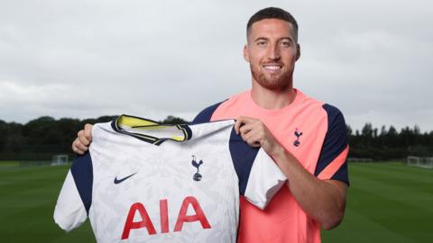 Matt Doherty poses with a Spurs shirt