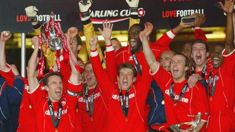 Middlesbrough players lift the trophy above after beating Bolton