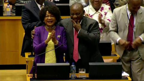 Cyril Ramaphosa smiles with Baleka Mbete in the South African parliament after he was elected president on 15 February 2018