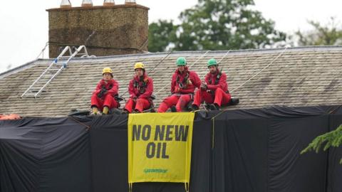 Greenpeace activists on the roof of Prime Minister Rishi Sunak's house