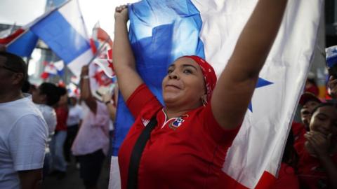 People celebrate the ruling of the Supreme Court of Justice that declared the law contract between the State and Minera Panama a subsidiary of the Canadian First Quantum Minerals (FQM) unconstitutional, in Panama City, Panama, 28 November 2023.