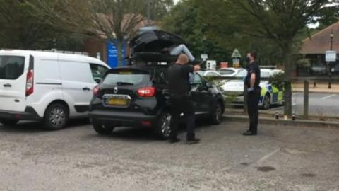 Man climbs out of roof box