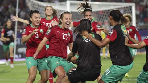 Morocco's women celebrate a goal together at Wafcon 2022