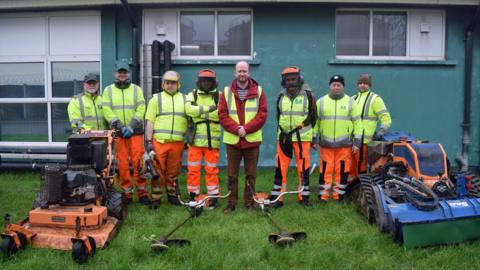 Councillor Tom Briars-Delve with some of the grass-cutting team