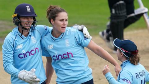 Amy Jones, Nat Sciver and Tammy Beaumont celebrate a wicket