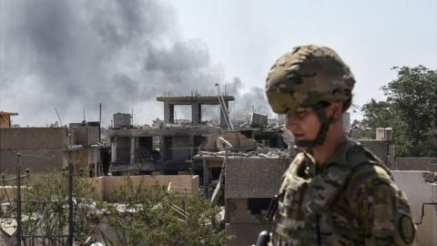 A US soldier advising Iraqi forces is seen in the city of Mosul on June 21, 2017