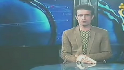 An injured Afghan TV presenter broadcasts after an attack on his own station