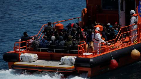 Migrants on a rescue ship off the coast in the Strait of Gibraltar