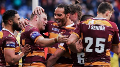 Huddersfield ran in three first-half tries to set themselves on the road to victory