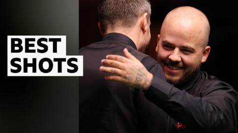 Luca Brecel and Mark Selby hug each other at The Crucible