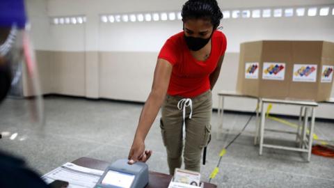 A woman votes in Caracas. 6 Dec 2020