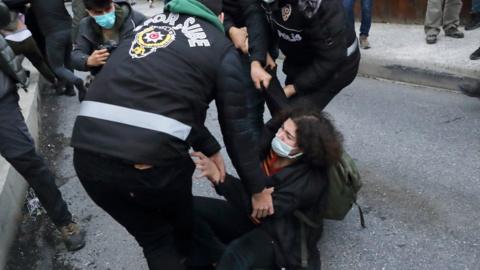 A woman scuffles with officers at Bogazici University, 1 February