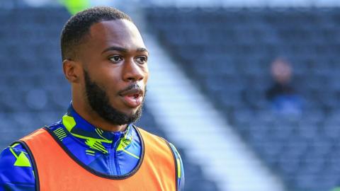 Corey Blackett-Taylor warns up for Derby County