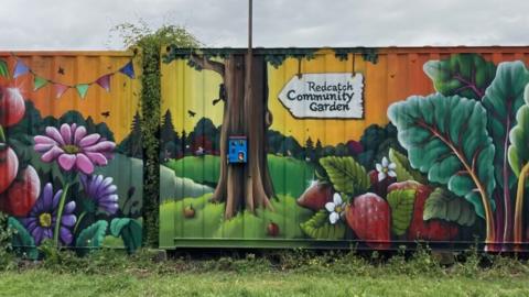 A vibrant mural on Redcatch Community Garden's fence