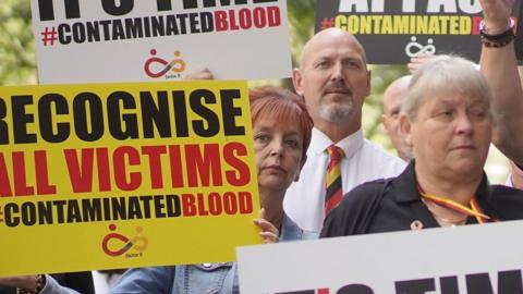 Infected blood victims and their relatives protest in Westminster.