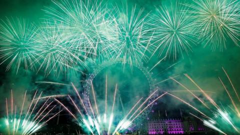 fireworks explode around the London Eye