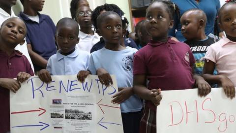 Children protest the end of TPS in Miami