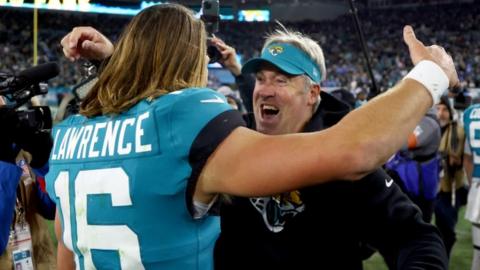 Trevor Lawrence celebrates with Jacksonville Jaguars coach Doug Pederson