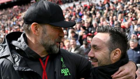 Jurgen Klopp and Roberto de Zerbi share a hug at Anfield