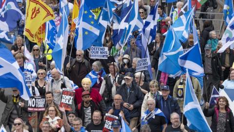 Scottish independence supporters march through Glasgow during an All Under One Banner march in May 2022