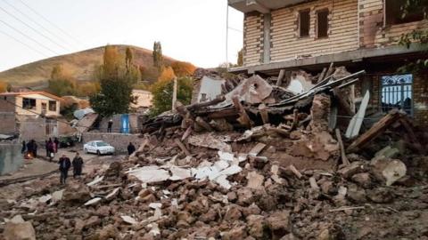 Debris of buildings in the Iranian village of Varnakesh on 8 November