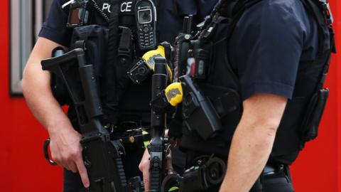 armed police holding guns in Liverpool