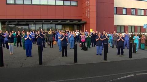 Health workers clapping for those keeping the nation going