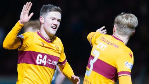 Motherwell's Blair Spittal (L) celebrates scoring to make it 2-0 with teammate Georgie Gent (R) during a cinch Premiership match between Motherwell and Ross County at Fir Park