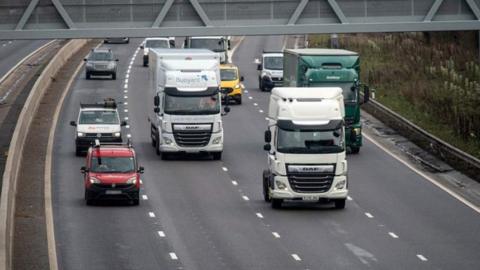 Lorries and cars on a motorway