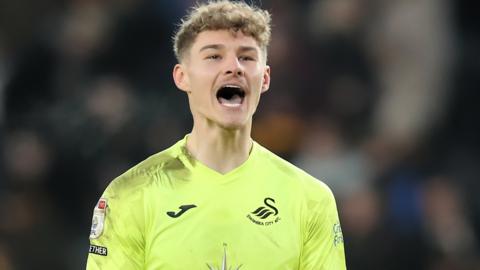 Swansea goalkeeper Carl Rushworth celebrates