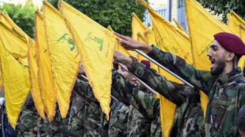 Hezbollah fighters attend the funeral of commander in Beirut on 23 September 2024